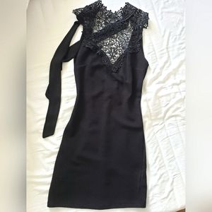 Black bodycon dress with ornate neckline
